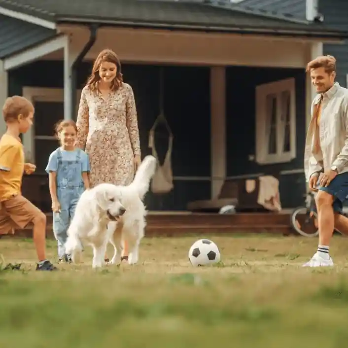 Family-playing-in-front-of-new-roof.webp